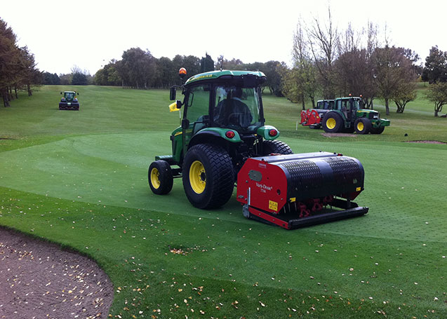 image of verti-draining on golf course